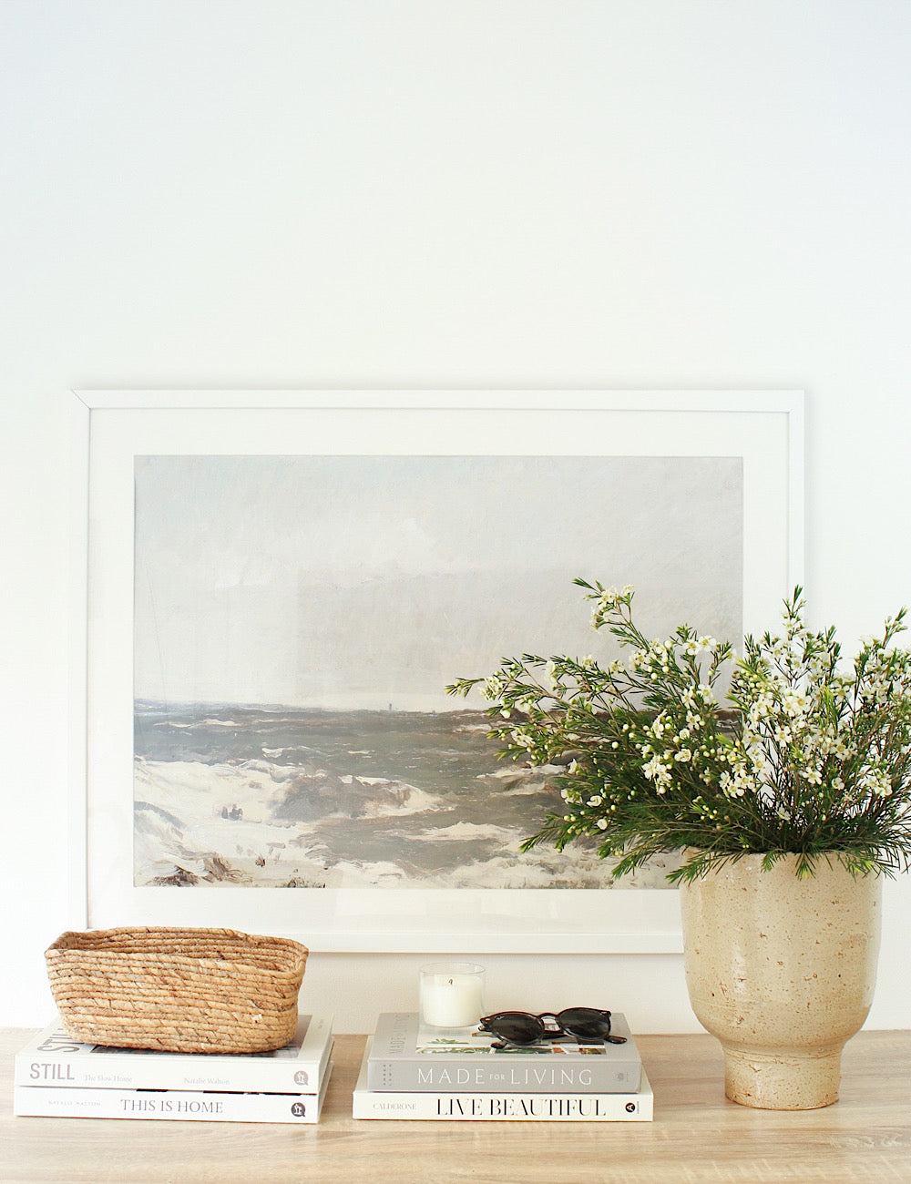 Luna Indoor planter styled on a console table with wild flowers in it.