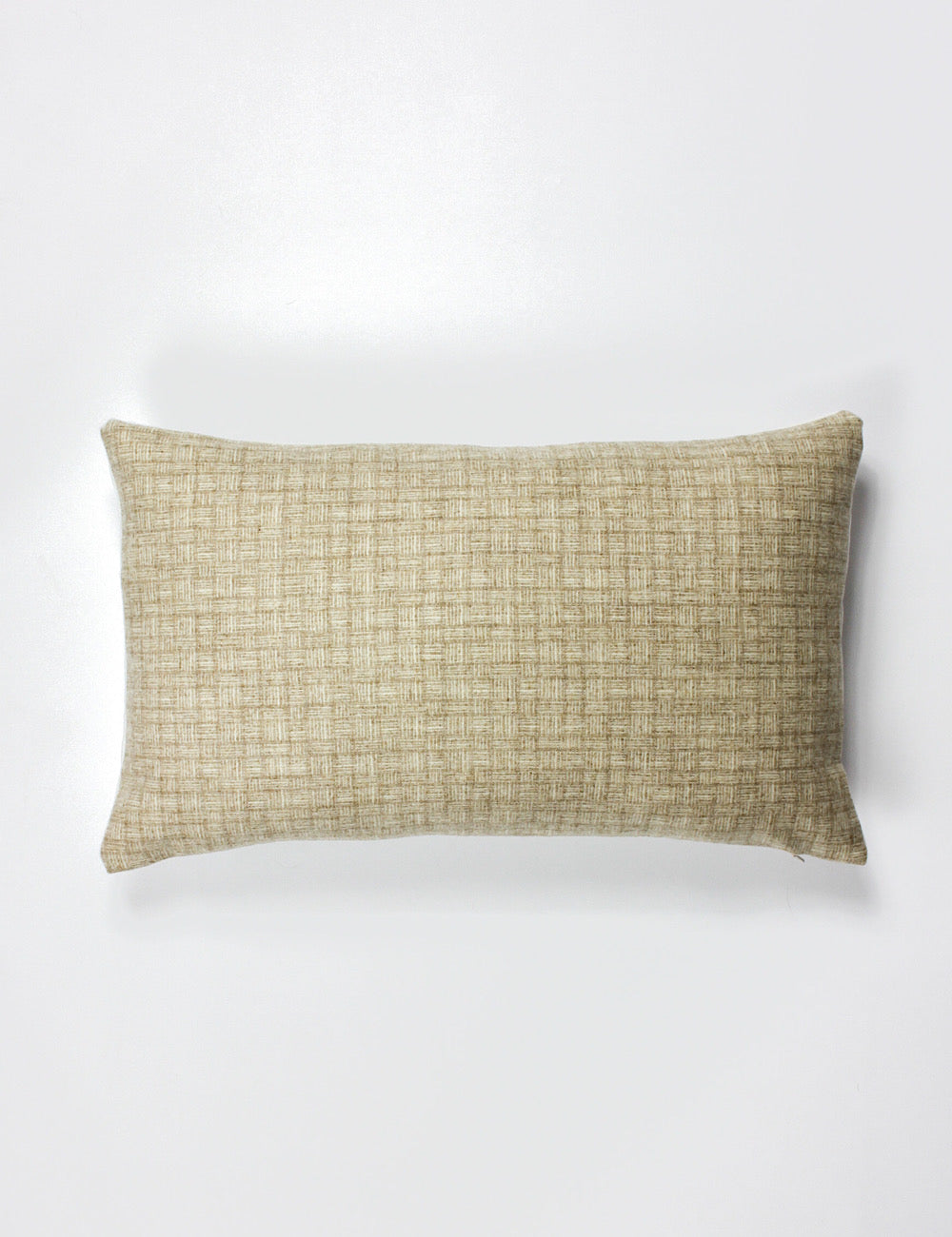 Lumbar scatter cushion cover with a neutral colour and subtle small scale woven pattern going across.
