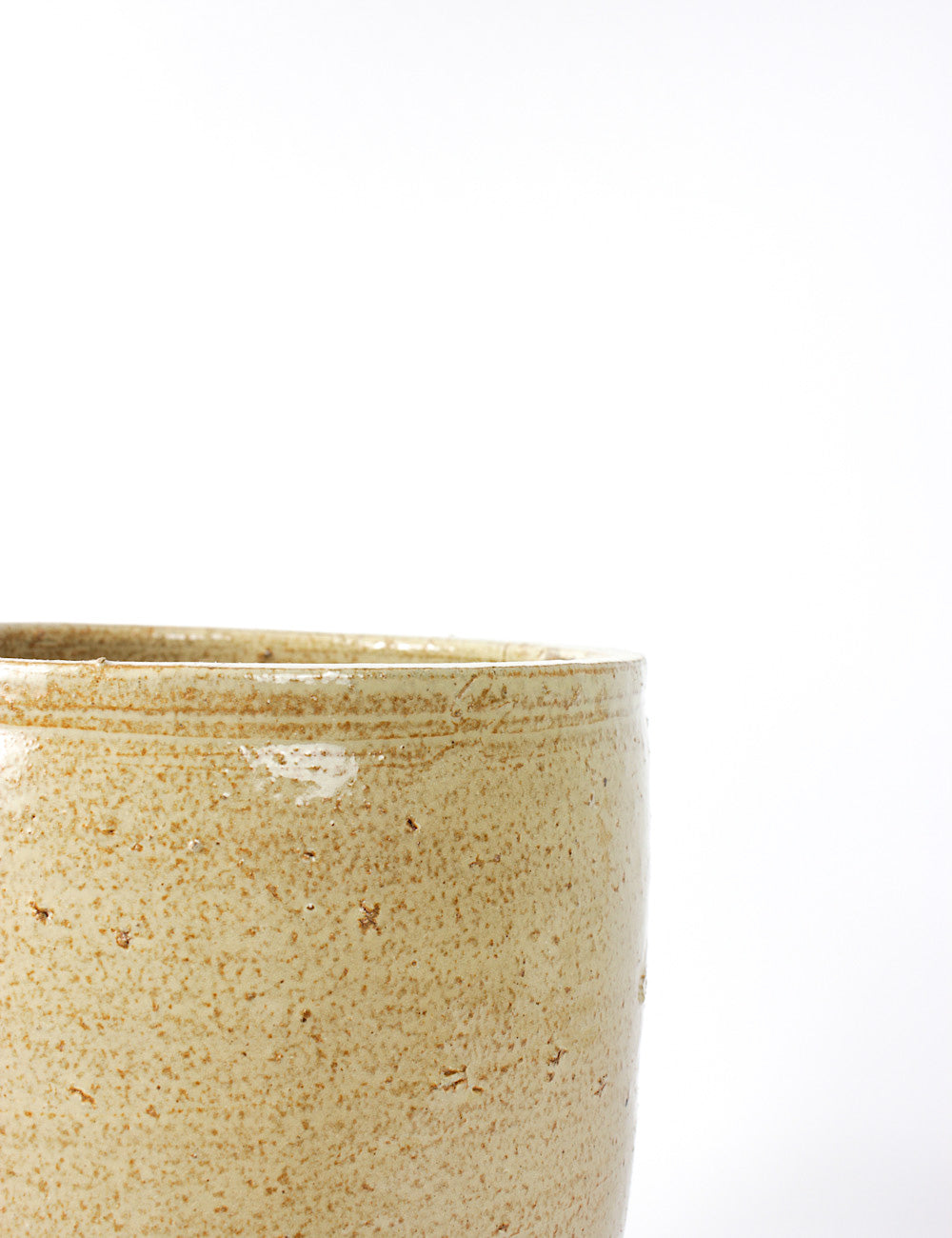 Close up of the luna indoor planter, capturing it's beige porous finish.