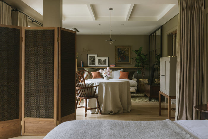 Open plan room with bed, sofa and dining table centred. Visit for Mother's Day. 