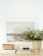 Luna Indoor planter styled on a console table with wild flowers in it. 