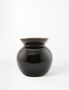 Black Glass vase with a round body and a wider top opening. Subtle speckled finish.