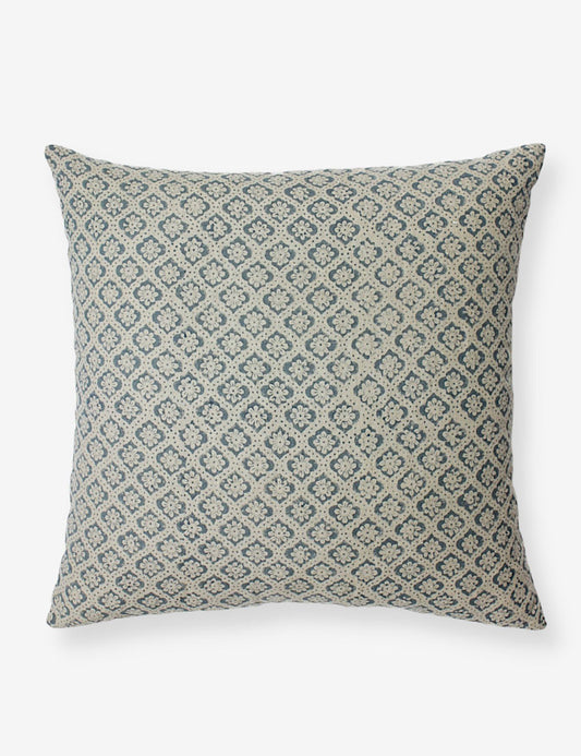 Square blue cushion cover with an intricate floral block print pattern running across.
