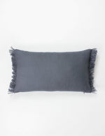 lumbar cushion in blue with fringe detailing on either side. 100% linen.