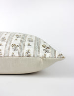 Side shot of the phoebe floral cushion capturing its hidden zip and stone coloured back fabric.
